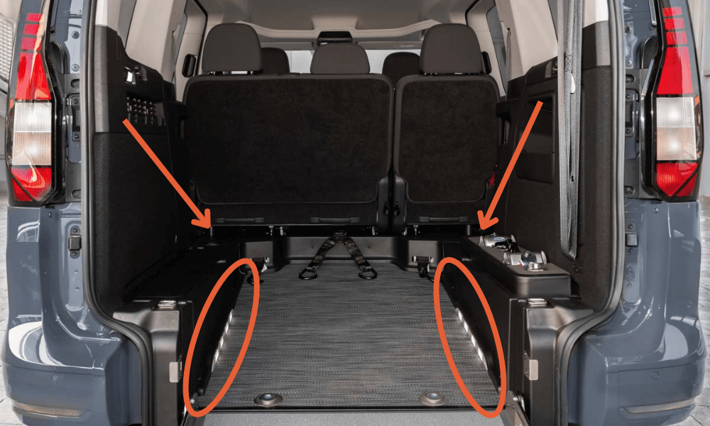 Interior of a wheelchair-accessible vehicle with integrated side lighting for enhanced safety